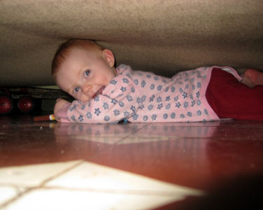 What is she doing under the bed?